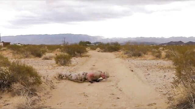 Camouflaged army boy nude crawling in desert, muscular ass exposed