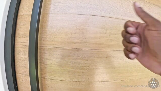 Angela White thumbs up by wooden barrel in tight top, huge tits tease