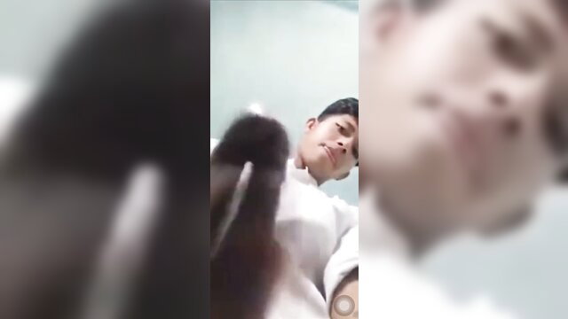 Cute Asian guy in white shirt holds cock close-up POV cumshot