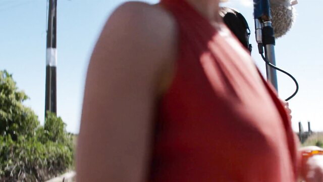 Brittany Snow in tight red dress, outdoor closeup