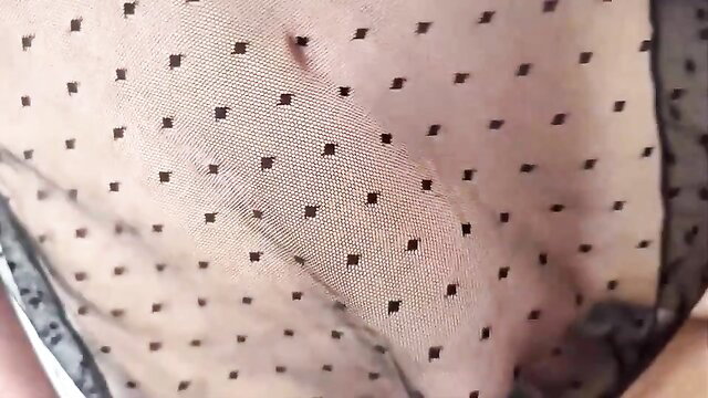 Lustful MILF in sheer polka dot lingerie closeup