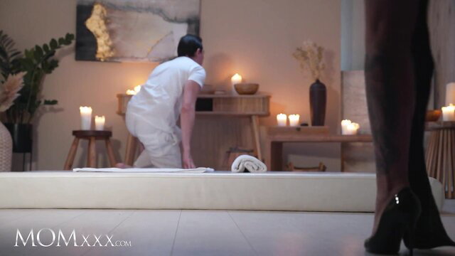 Roxi Keogh in sexy high heels at massage table with masseur