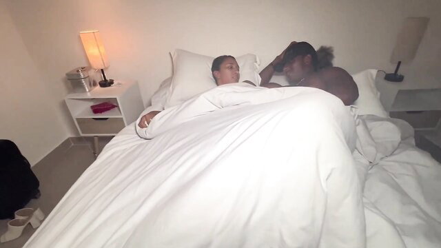 Asian stepmom and black stepson-in-law cuddling nude in bed hotel