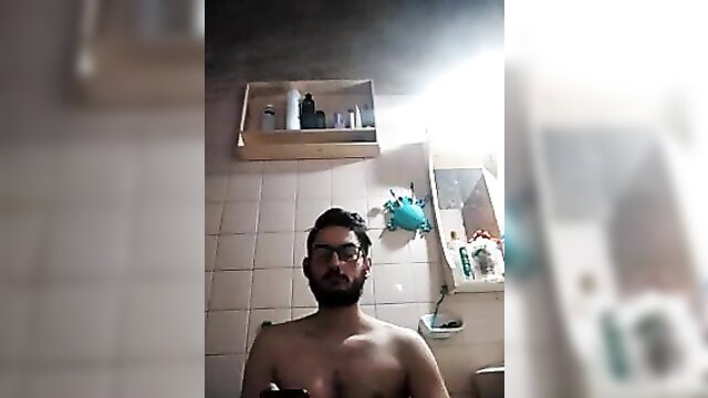 Nude brunette guy with beard masturbating in bathroom cam show