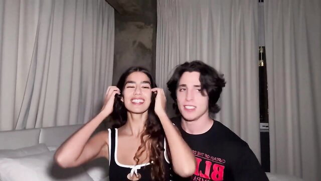 Pregnant brunette beauty with curly hair smiles wide with handsome guy in amateur vid