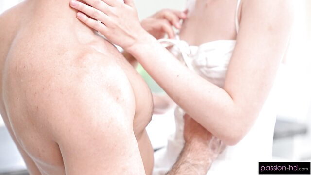 Brock Cooper topless with blonde in lingerie gripping his neck intimately