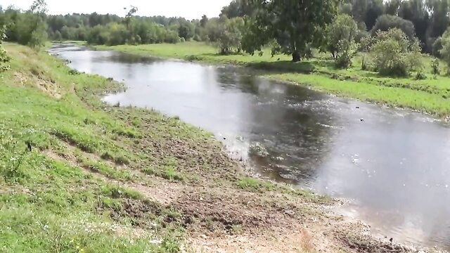 Nude woman bathing nude in Derzha river outdoors