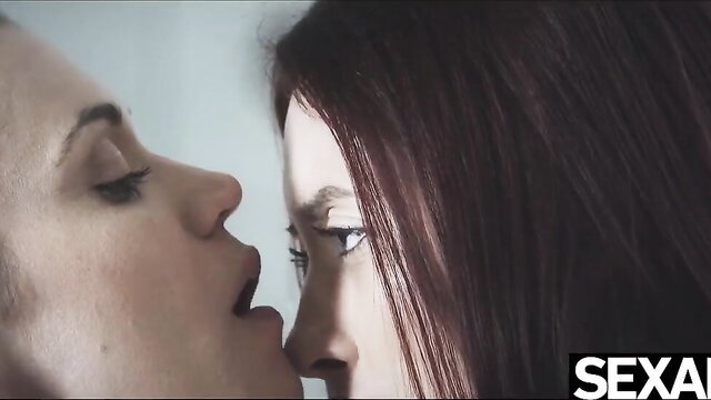 Busty redhead lesbians kissing passionately close-up