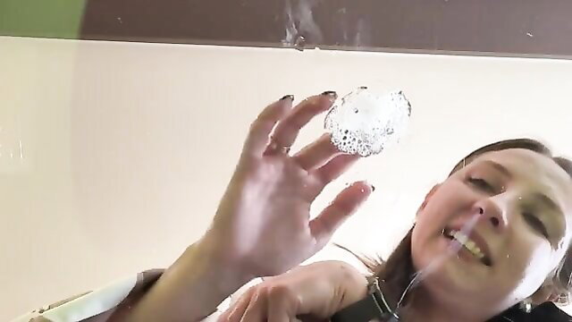 Phlegm Domme coughing up thick spit in femdom humiliation closeup