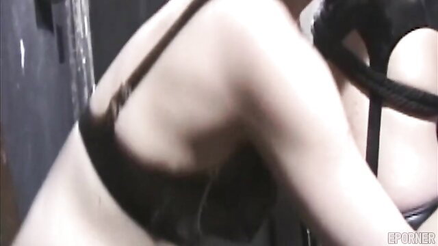 Shameless MILF in black lingerie and garter straps, kinky lesdom pose