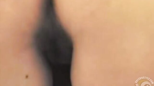 Blurry hidden cam view of woman's big pale ass in public toilet