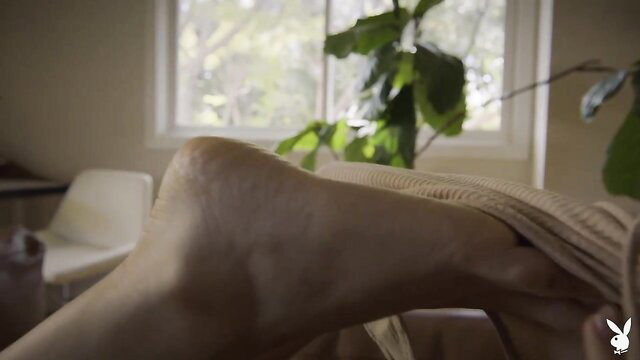 Nicole Aniston nude blonde posing bare with legs spread on couch