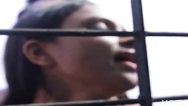 Indian woman in hot web series licks through jail bars seductively