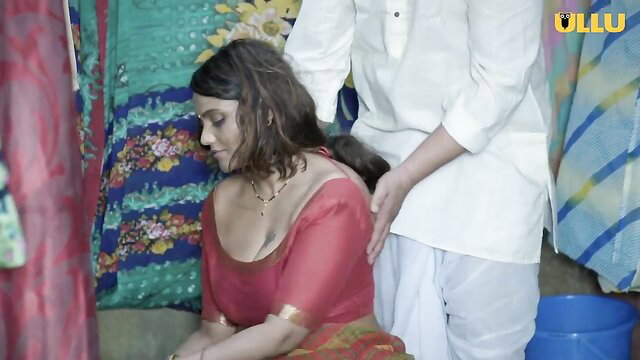 Village Indian aunty in red saree gets massaged by man, deep cleavage