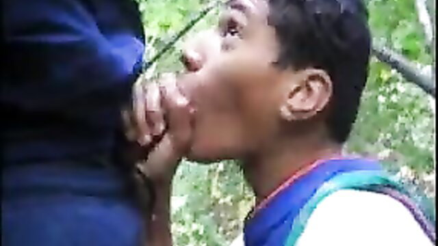 Cute black twink kneels sucking dick outdoors in amateur gay video