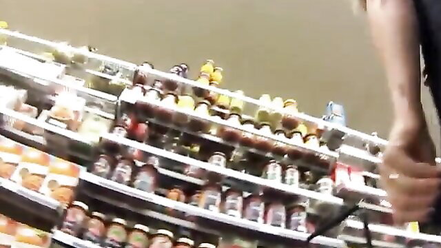 Upskirt view of supermarket shelves with jars from behind