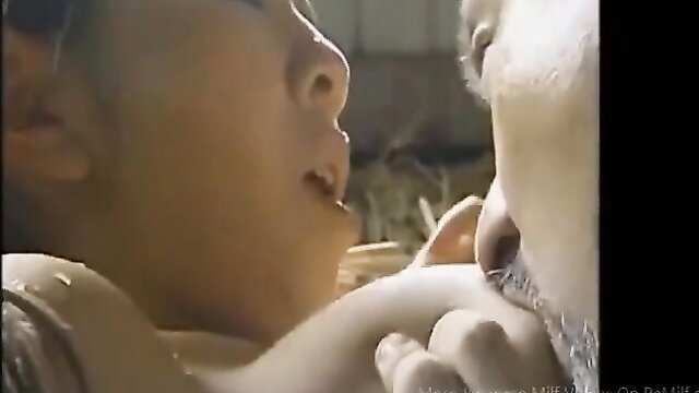 Japanese MILF wife wet breasts in rain closeup suckling