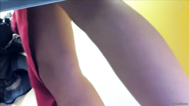 Cutie spreads legs for smooth muff upskirt voyeur closeup