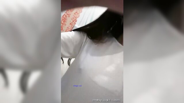 Blurry Chinese teen in white top and hijab on cam show