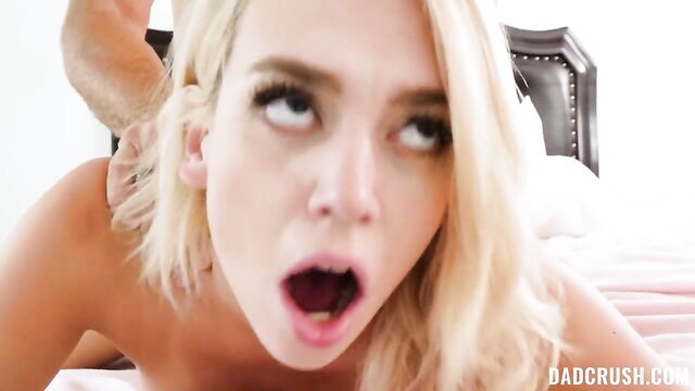 Blonde stepdaughter with wide eyes and open mouth in intense sex closeup
