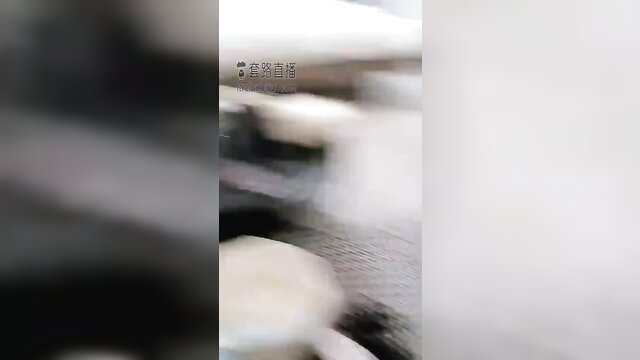 Blurry Chinese femdom tease with white boots and nylons