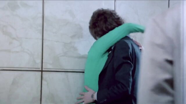 Barbara Broadcast 35mm remastered embrace in green top and suit