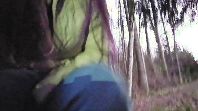 Amateur girl peeing by road at sunset in green top blue shorts