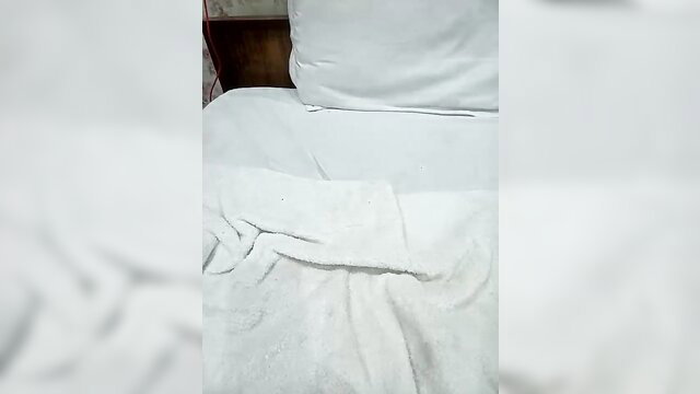 Horny spic mommy in white towel on bed solo tease