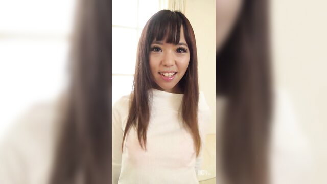 Smiling Japanese JAV babe in white top, long straight black hair, closeup portrait