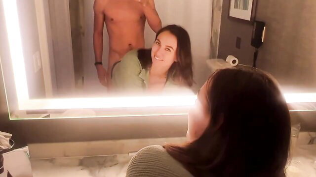 Piper Quinn smiles at nude man grabbing her in bathroom mirror