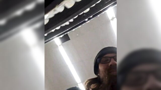 Tatted Walmart stocker bearded guy in beanie, warehouse POV thumbnail