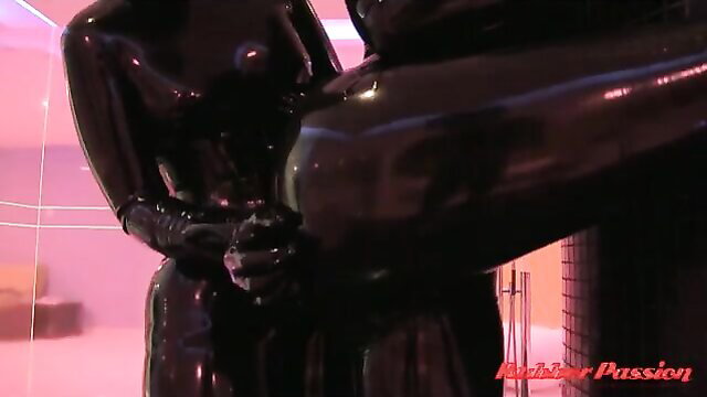 Shiny latex rubber dolls groping big asses in fetish spa scene