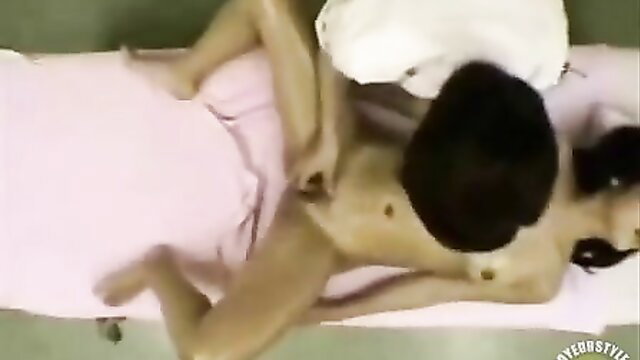 Curvy Asian lady gets fingered by man on bed