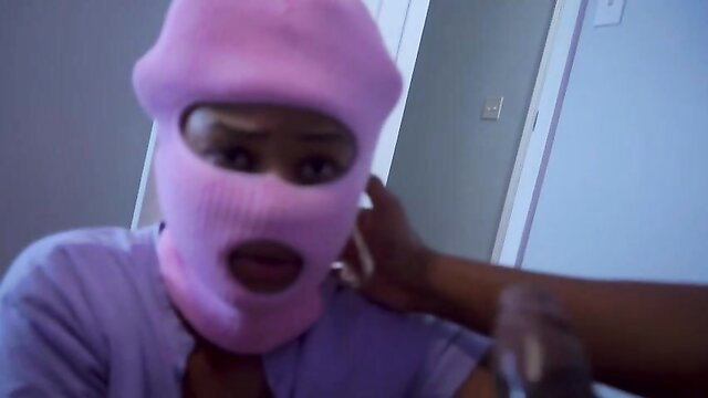 Pink balaclava girl deepthroating black stud, mouth wide open