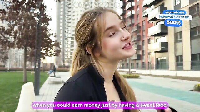 Pretty blonde teen with sweet face smiling outdoors, softcore tease