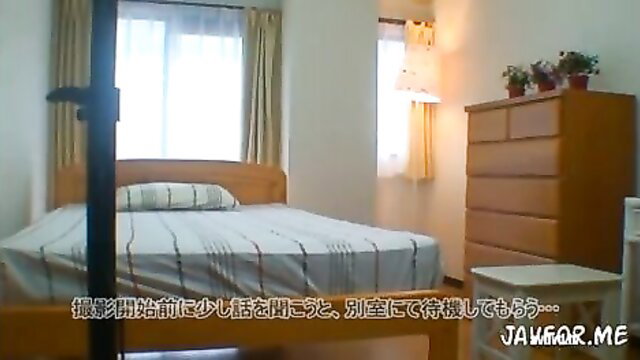 Busty Japanese wife teases with massive tits on bed JAV