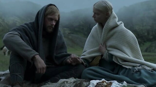 Anya Taylor-Joy in blanket with Viking hunk, The Northman 2022 hot scene