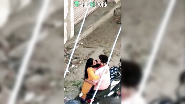 Desi wife in yellow saree hugs lover passionately on bike outdoors
