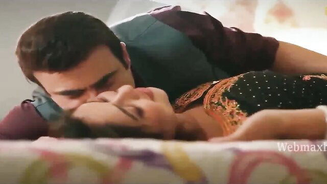 Indian couple intimate kiss on bed in Balam Pichkari Ullu web series