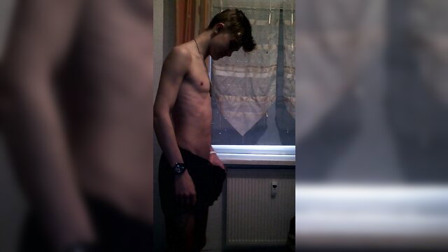 Teen boy shirtless in underwear by window, amateur home video