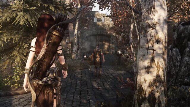 Redhead archer Aela in skimpy leather with companion at cave entrance