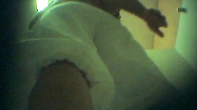 Candid shot of woman's big white panties booty from behind in bathroom door