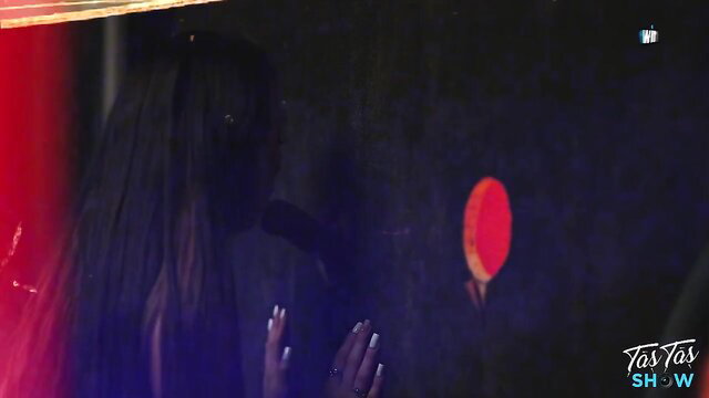 Mystery veiled brunette in dark red-lit pose, slutty good girl vibe