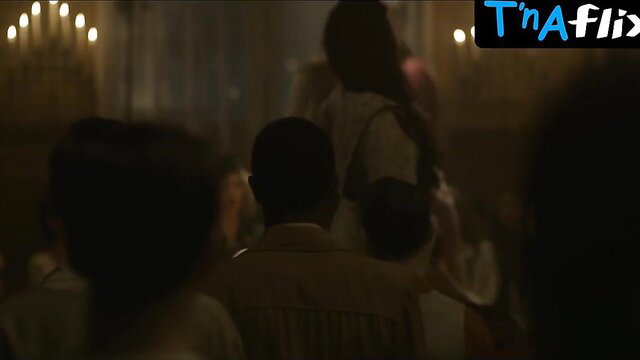 Bella Heathcote cleavage in candlelit dress scene from Strange Angel