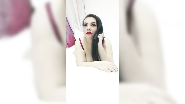 Sexy amputee babe posing topless in red lingerie, sultry gaze