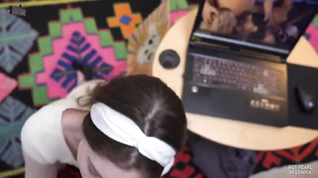 Hot brunette with white headband bends over laptop in sexy public amateur scene