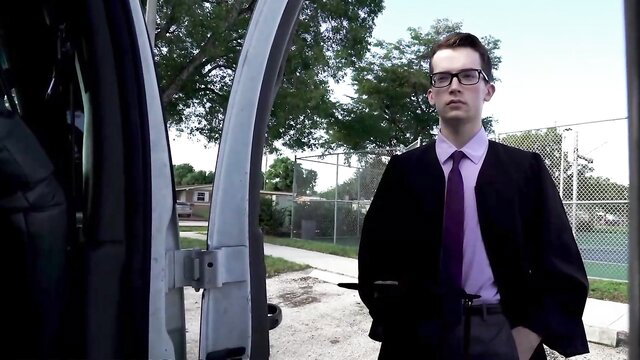 Wesley Woods in suit by van in Baitbus graduate trap scene