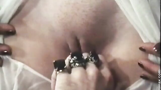 Retro porn closeup: woman's shaved pussy spread by manicured hands with rings