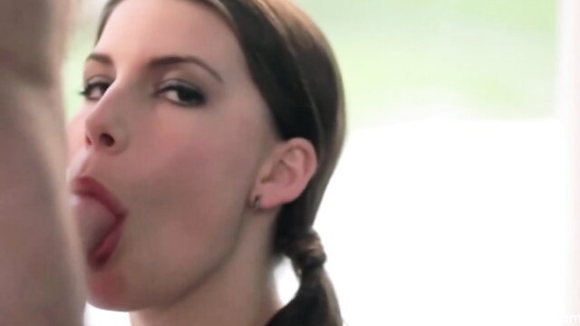 Glamorous brunette with tongue out in wild oral closeup