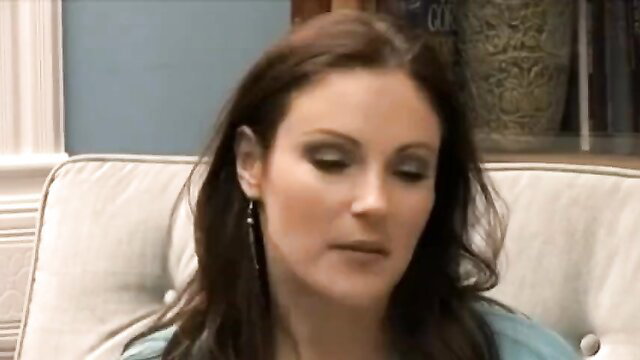 Brunette beauty with smokey eyes in tight blue top, seductive gaze